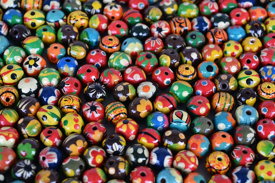 closeup photo of assorted-color beads, jewellery, wood, chain