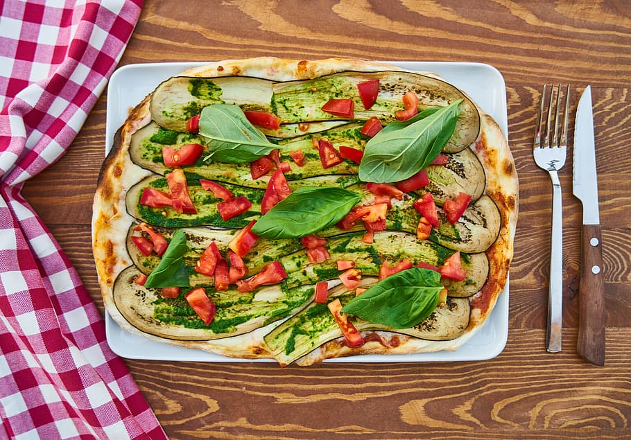 flat lay photography of baked pizza on white tray, dough, product photo