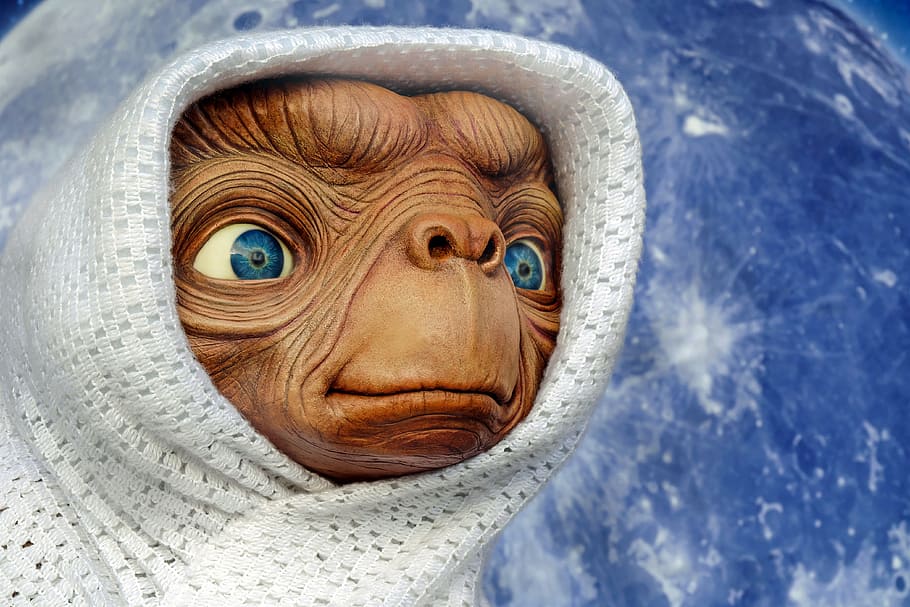 brown alien with white scarf, et, extraterrestrial, creature