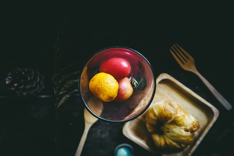 apple and orange fruits in bowl beside plate and fork, assorted fruit on glass container HD wallpaper