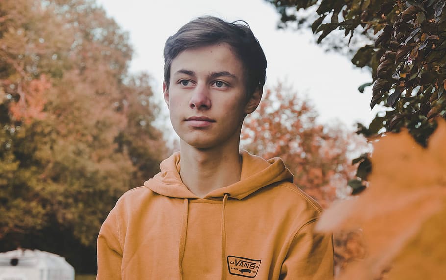 man wearing yellow pullover hoodie, portrait, one person, young adult HD wallpaper