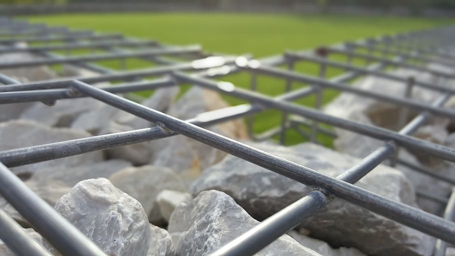 cliff, stone, metal, grid, grass, day, no people, focus on foreground HD wallpaper