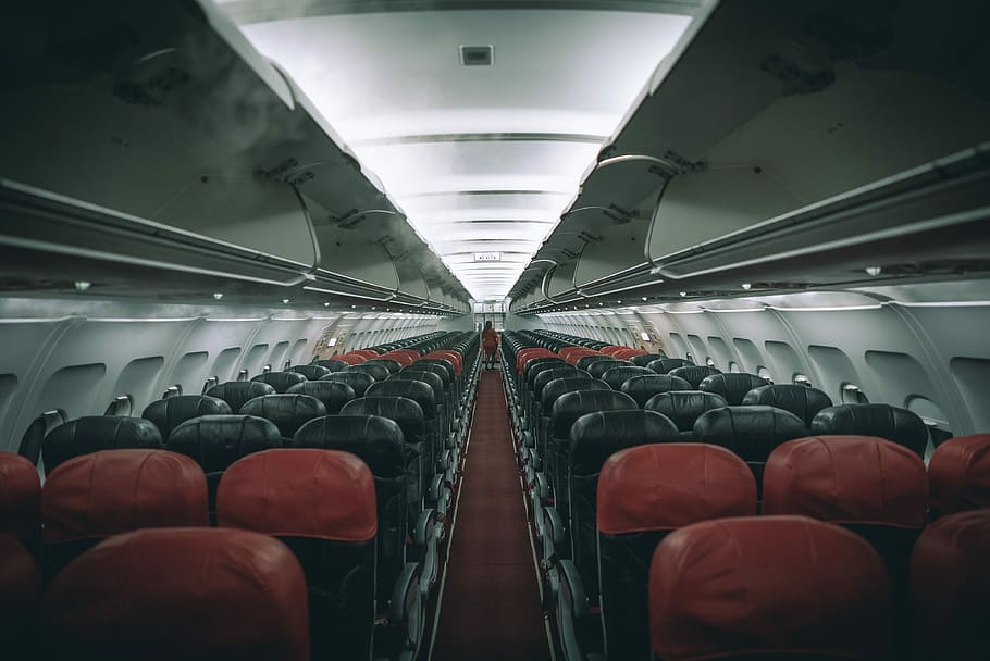 person walking inside car, vacant airplane seats, empty airplane
