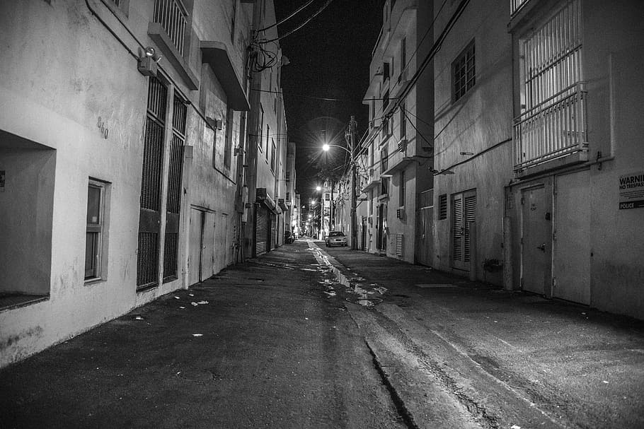 grayscale photography of street between buildings, miami beach