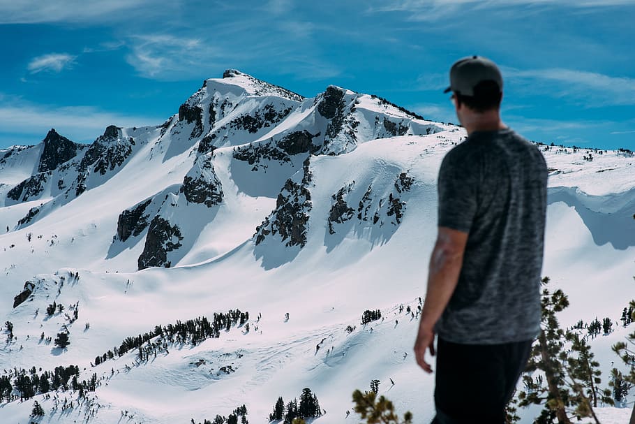 HD wallpaper: man looking at snow mountain, man standing on top of ...