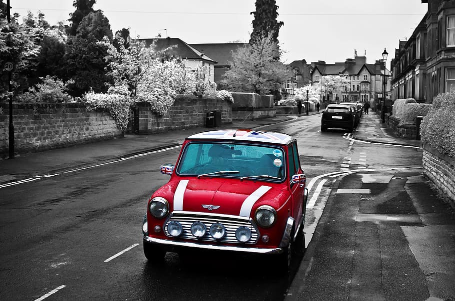 selective color photo of red Mini Cooper parked on the side of the road HD wallpaper