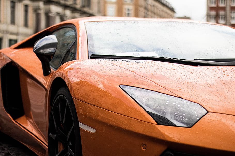 photo of orange Lamborghini Aventador, car, rain, copenhagen