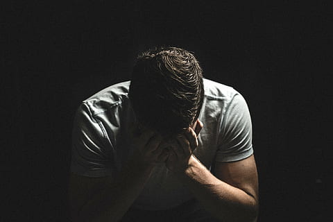 man holding his face while sitting on chair, wearing, gray HD wallpaper