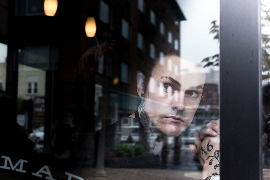 man looking outside through glass wall during daytime, architecture HD wallpaper