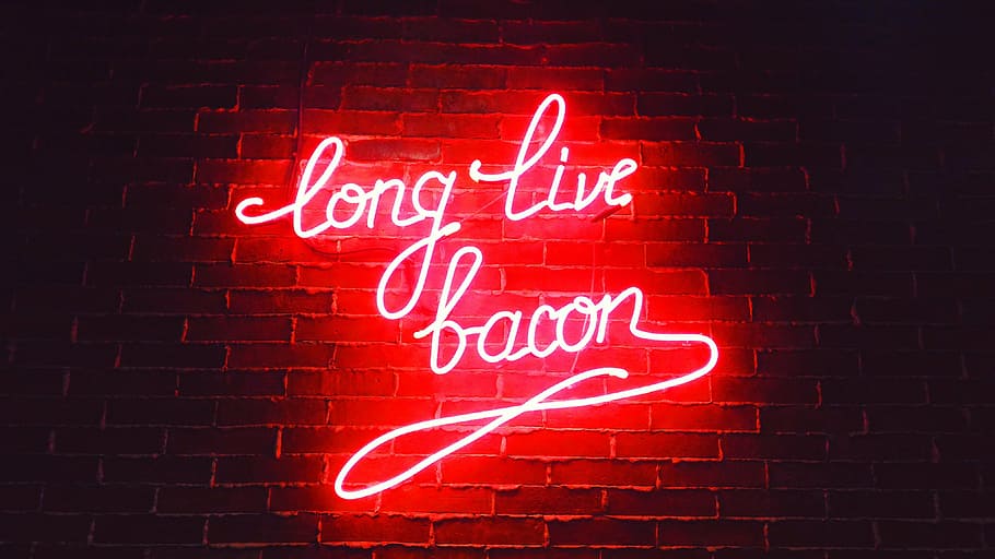 red long live bacon neon light signage on brown wall, dark, night
