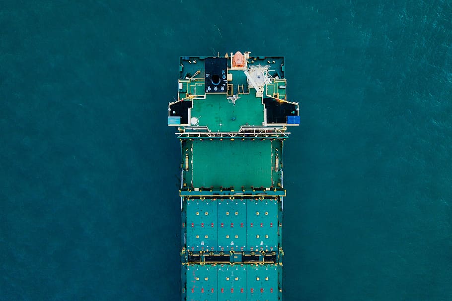 green cargo ship on body of water, aerial photography of green boat on water during daytime HD wallpaper