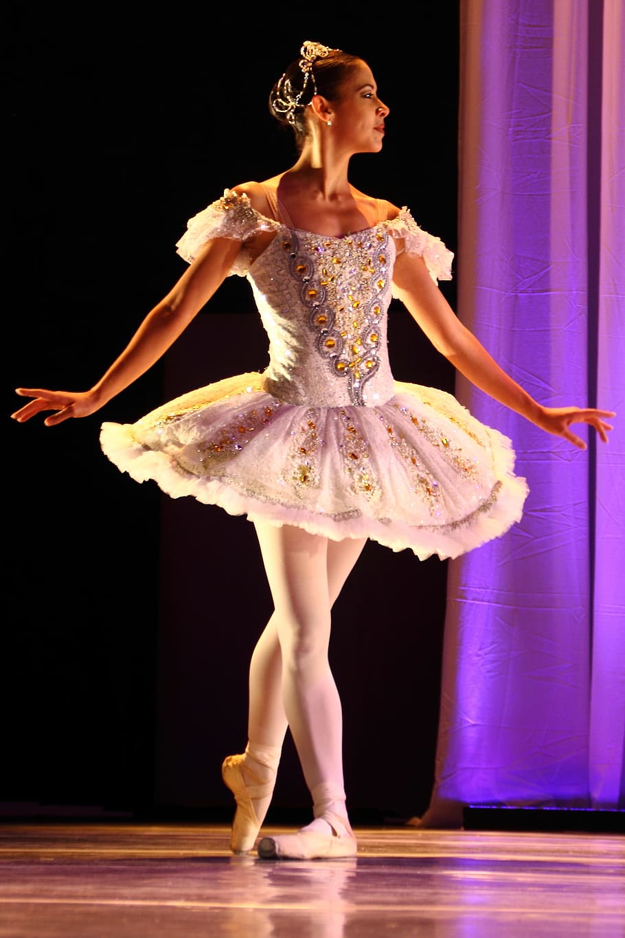 close up photo of woman wearing white ballerina dress, ballet