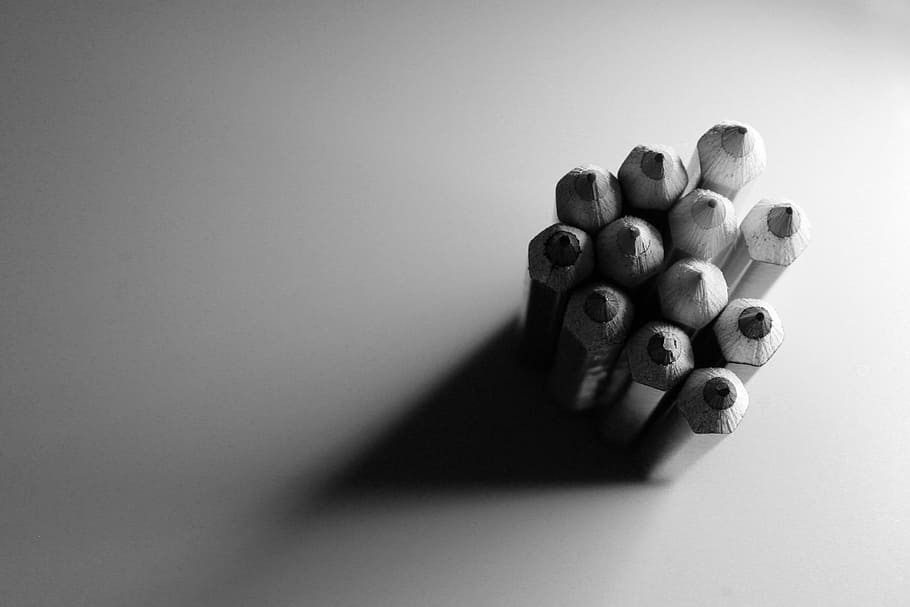 grayscale photography of stack of pencils, highlight, shadow
