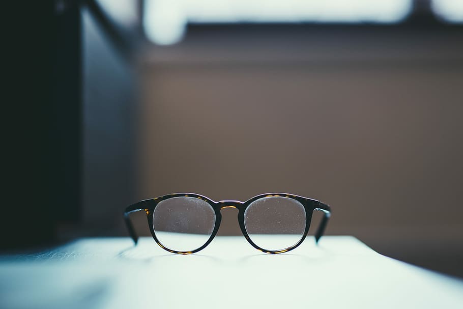 shallow focus photography of eyeglasses, black framed eyeglasses on white surface HD wallpaper