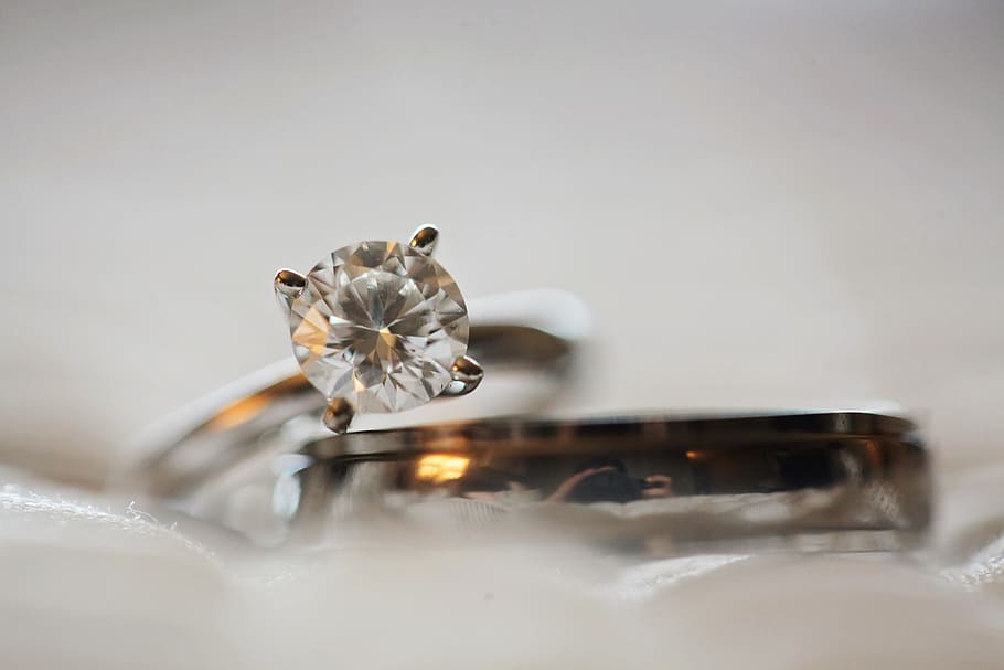 Close Up Photo of Diamond Stud Silver-colored Eternity Ring, blur