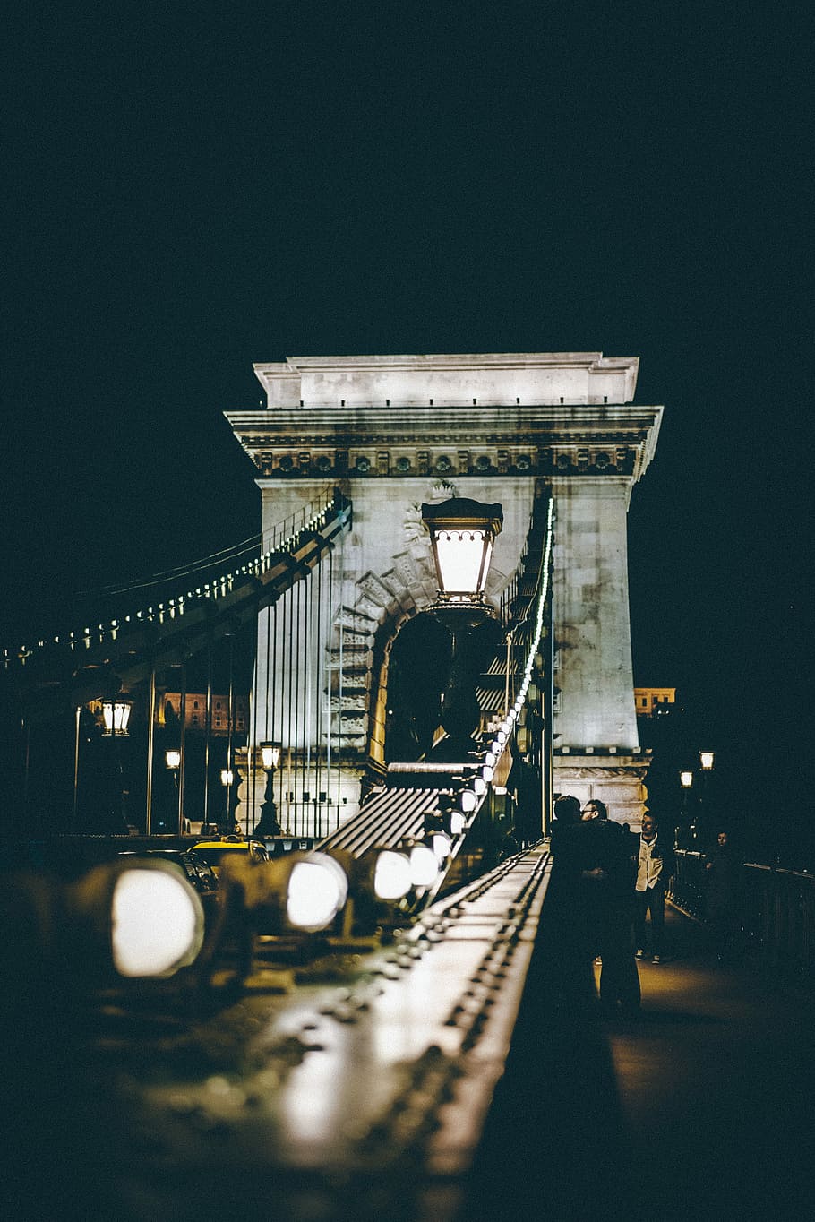 selective photography of bridge at night time, people on concrete arch bridge at nighttime HD wallpaper