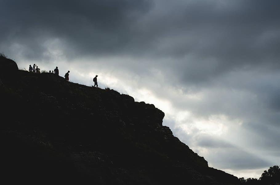 people at the top of a mountain during day, silhouette of person on top of mountain HD wallpaper