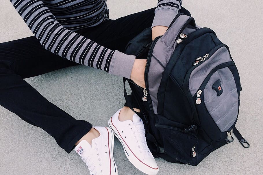 person searching inside black and gray backpack, student, school HD wallpaper