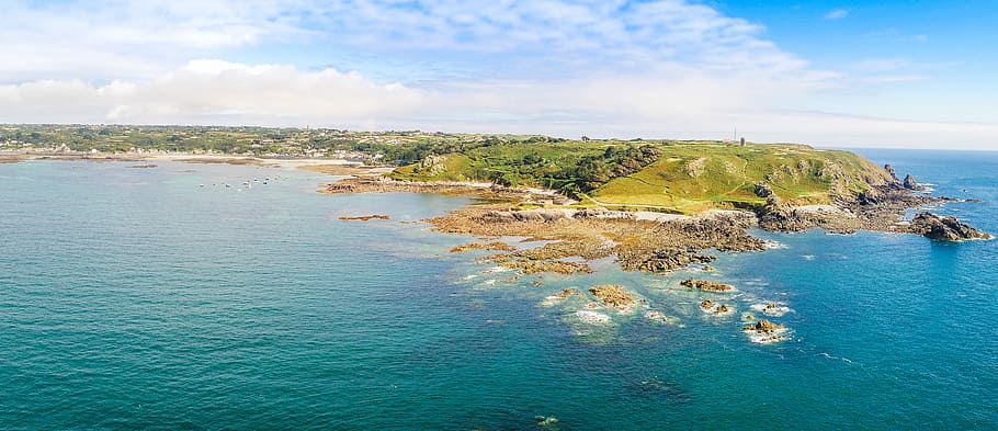 aerial view of land near body of water, aerial photography of island at daytime HD wallpaper