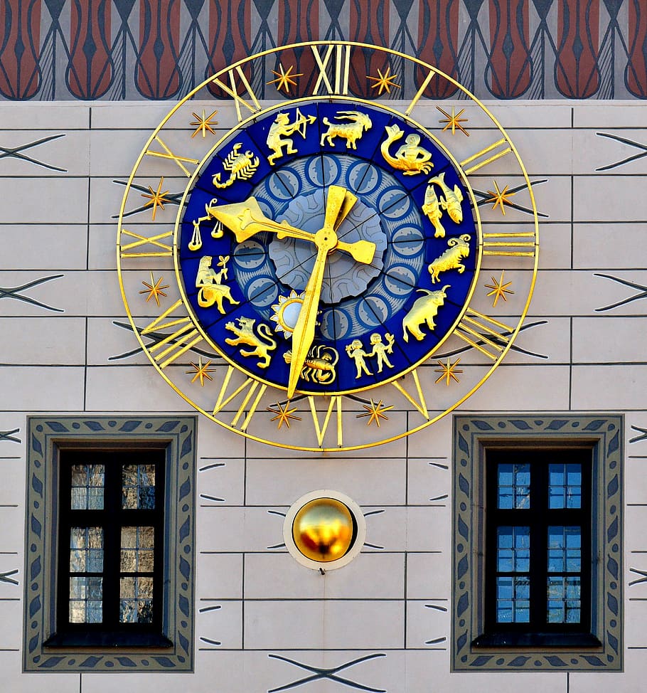 round gold-colored analog wall clock, clock tower, toy museum