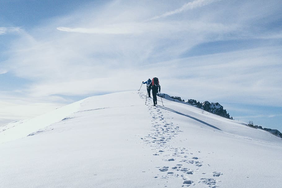 two person climbing on mountain covered snow, person walking on snow HD wallpaper