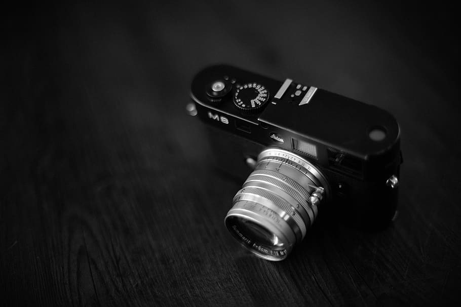 black and gray camera on wooden surface, black and silver MILC camera HD wallpaper