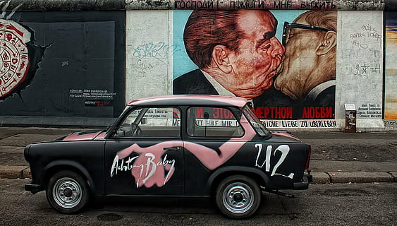 black and pink sedan beside two man kissing wall paint, east side HD wallpaper
