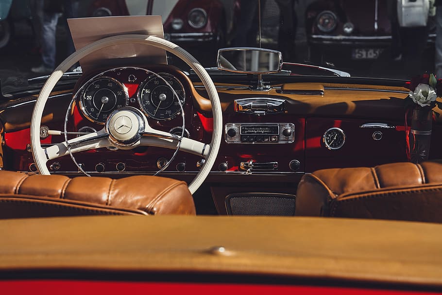 white steering wheel, vintage convertible car interior, dashboard