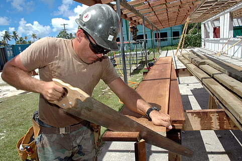 man holding wood saw, worker, construction, building, carpenter HD wallpaper