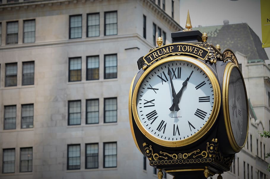 black and white trump tower clock in front of gray painted building HD wallpaper