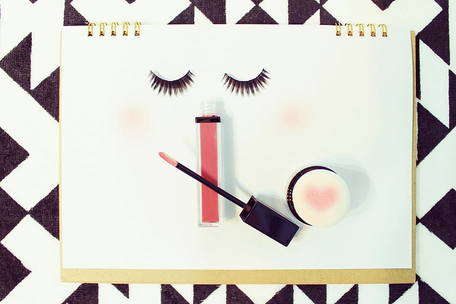 false eyelashes and makeup kits on paper, studio shot, indoors HD wallpaper