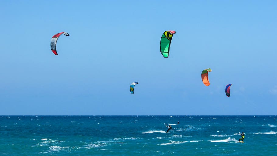 people parachuting over body of water during daytime, kite, surf