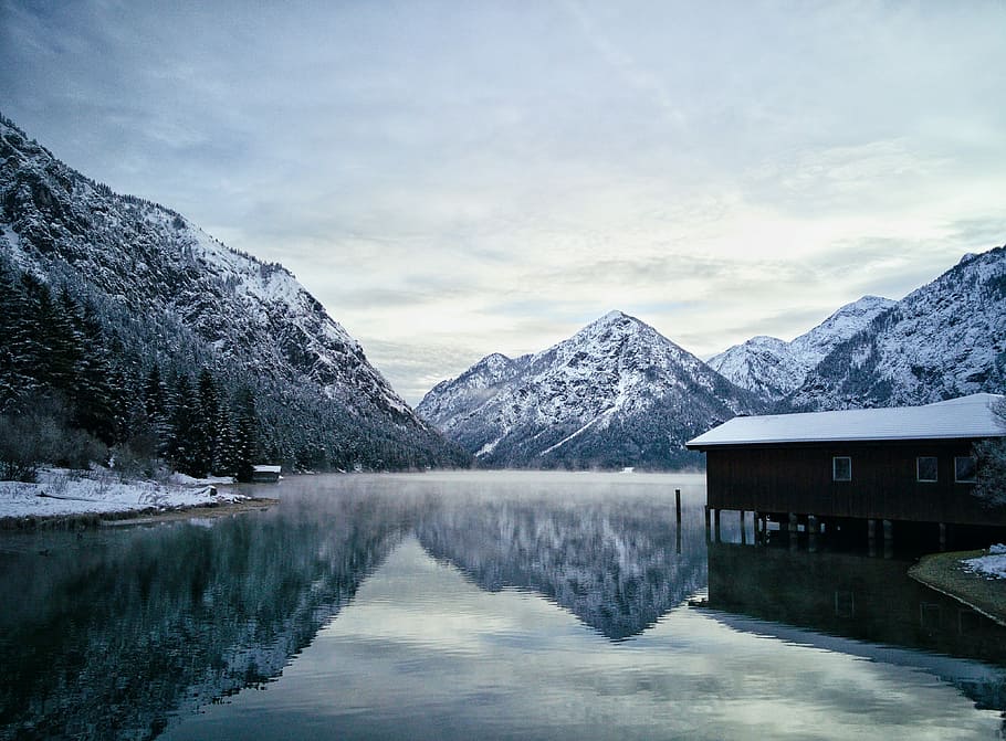residence house in water surrounding mountain, still photography of brown house above snow-capped mountain HD wallpaper