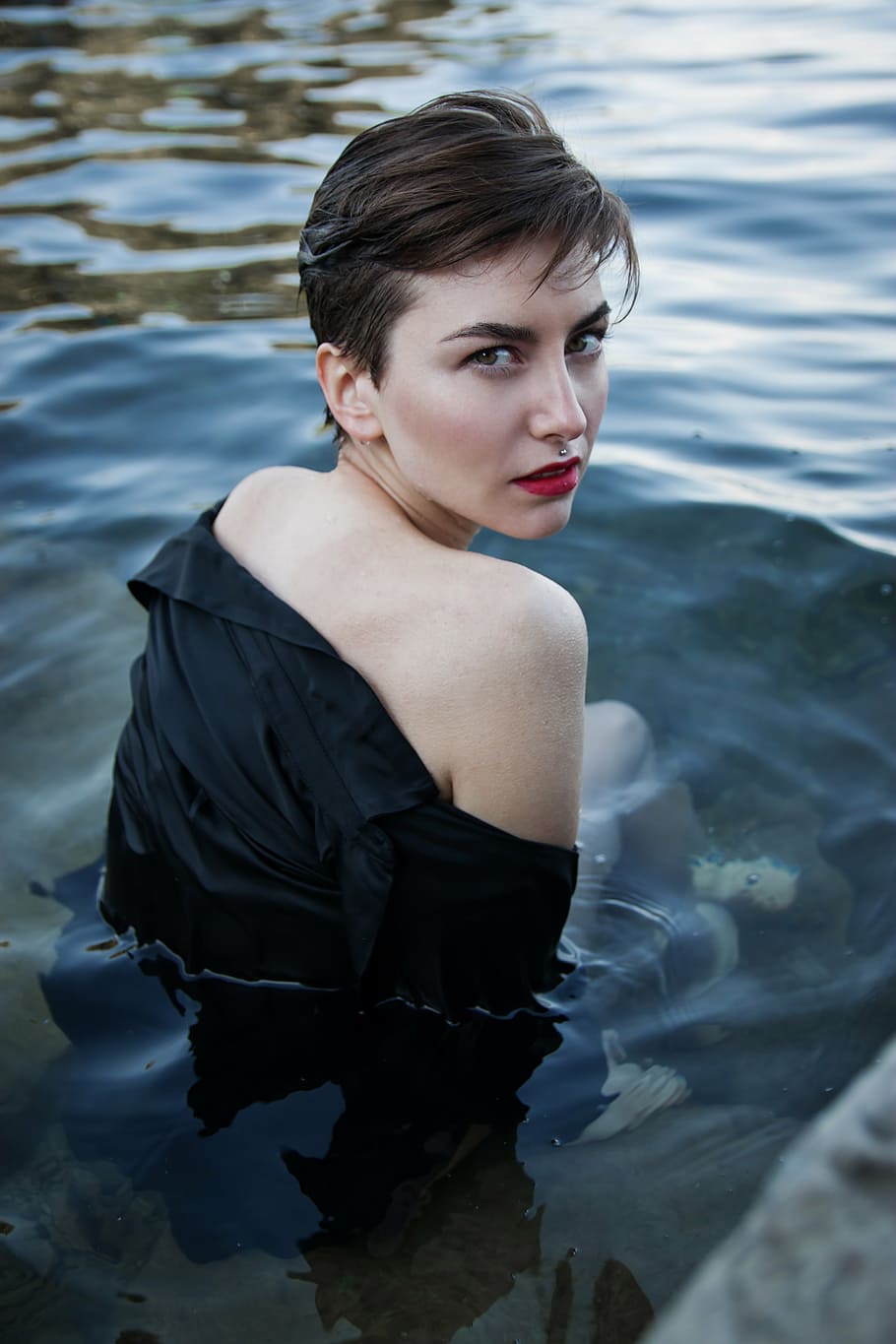 woman wearing black long-sleeved top sink her half body on water during daytime, HD wallpaper