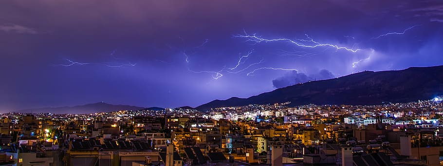 lightning occurring above mountain near city, lighting, athens HD wallpaper