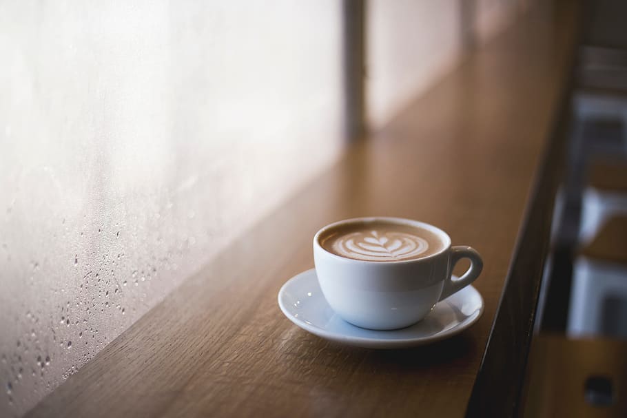 white ceramic teacup filled with coffee on white round ceramic saucer HD wallpaper