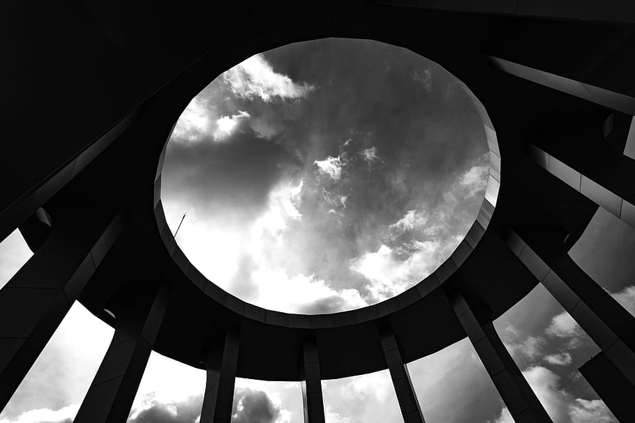 Grayscale Photo of a Round Building With Hole, abstract, architecture