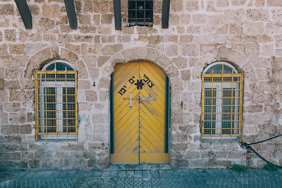 yellow and green wooden closed door on brown brick wall, architecture HD wallpaper