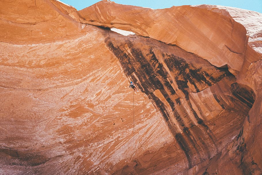 photo of rock formation, brown mountain under clear blue sky HD wallpaper