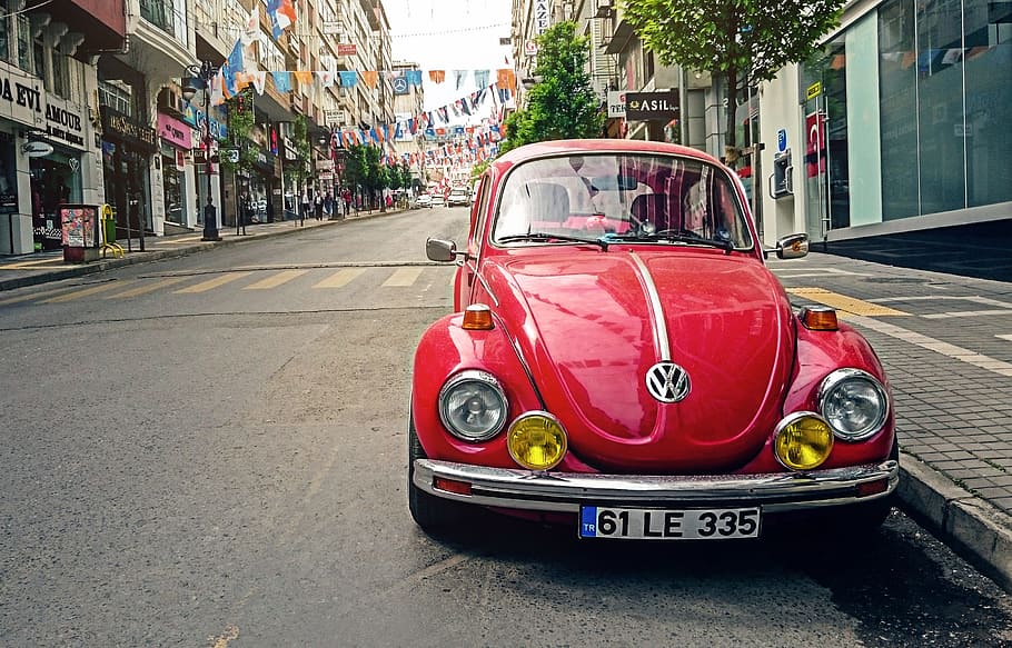 red Volkswagen Beetle car park beside concrete buildings, street, HD wallpaper