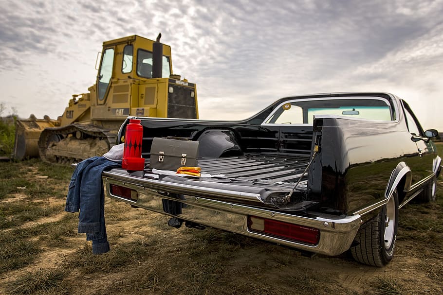 black car and brown suitcase, labor day, caterpillar, tractor