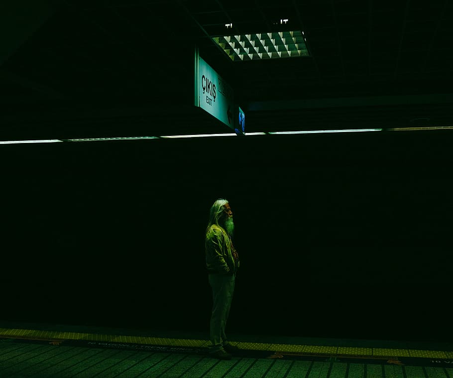 man standing train station, dark, people, old, alone, sign HD wallpaper