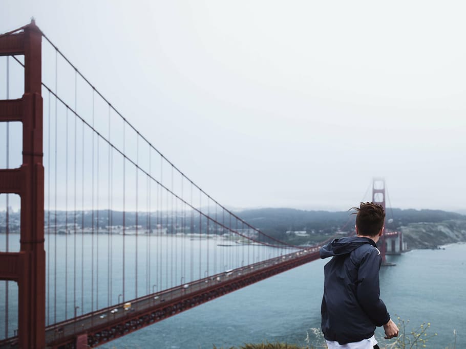 man standing near Golden Gate Bridge at daytime, person, wearing HD wallpaper