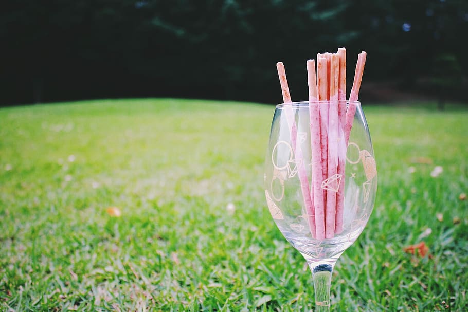 clear wine glass with wafer stick, drink, summer, outdoors, grass HD wallpaper
