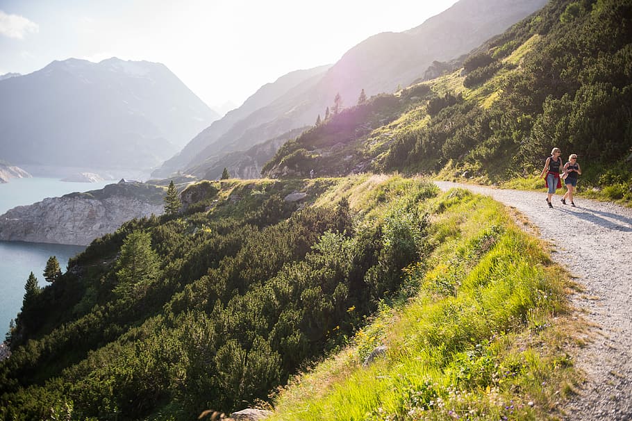 road beside body of water, two people walking on road, running HD wallpaper