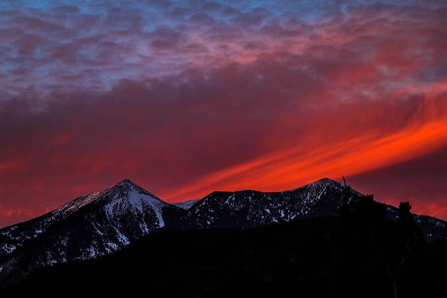 silhouette of mountain at golden our, snow-covered mountains during sunset HD wallpaper