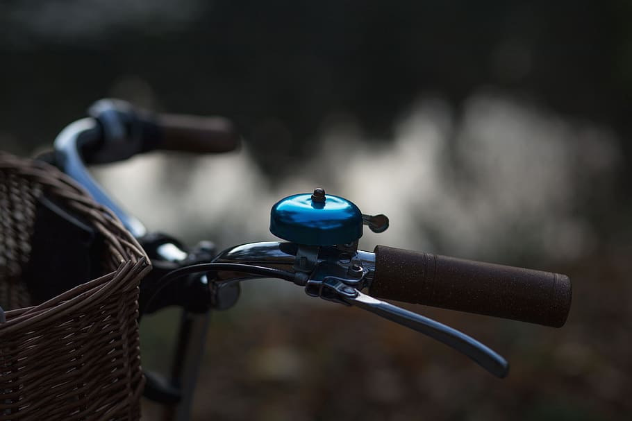 selective focus photography of bicycle with bell, background