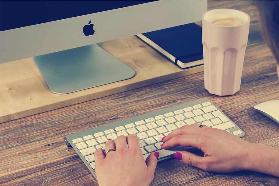 person using silver iMac, computer, desktop, keyboard, typing HD wallpaper