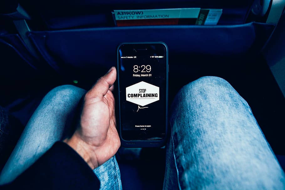 person holding black iPhone inside car, people, wallpaper, man HD wallpaper