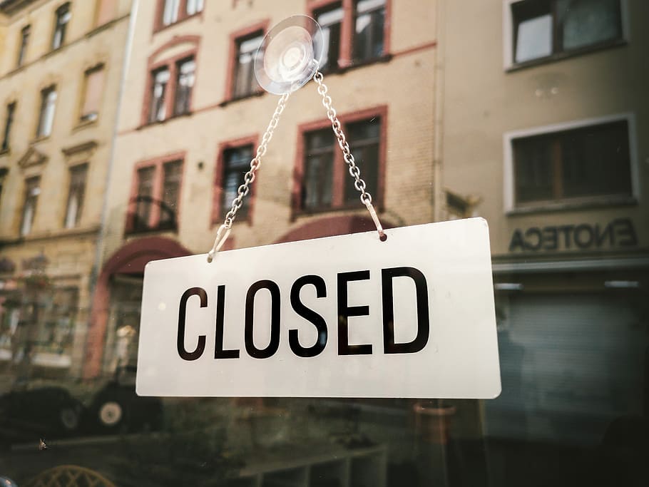 white closed sign hanging on glass, Closed signage on glass wall